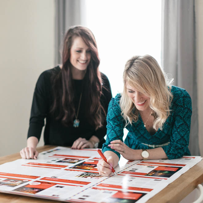 Karen and Heather reviewing designs