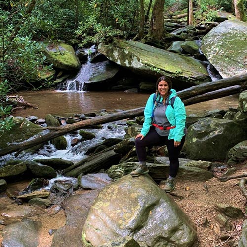 Lexi by a stream