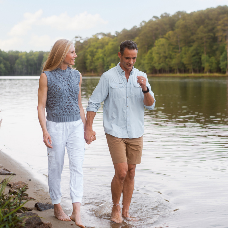 a Couple walking on the shore