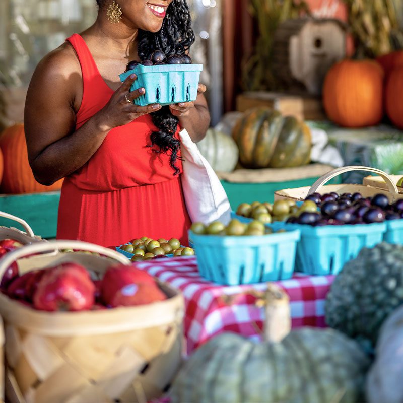 Green County CVB - woman shopping for fruit