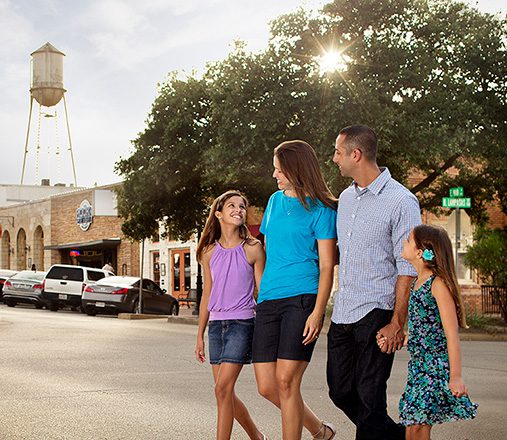 Family walking in downtown Round Rock