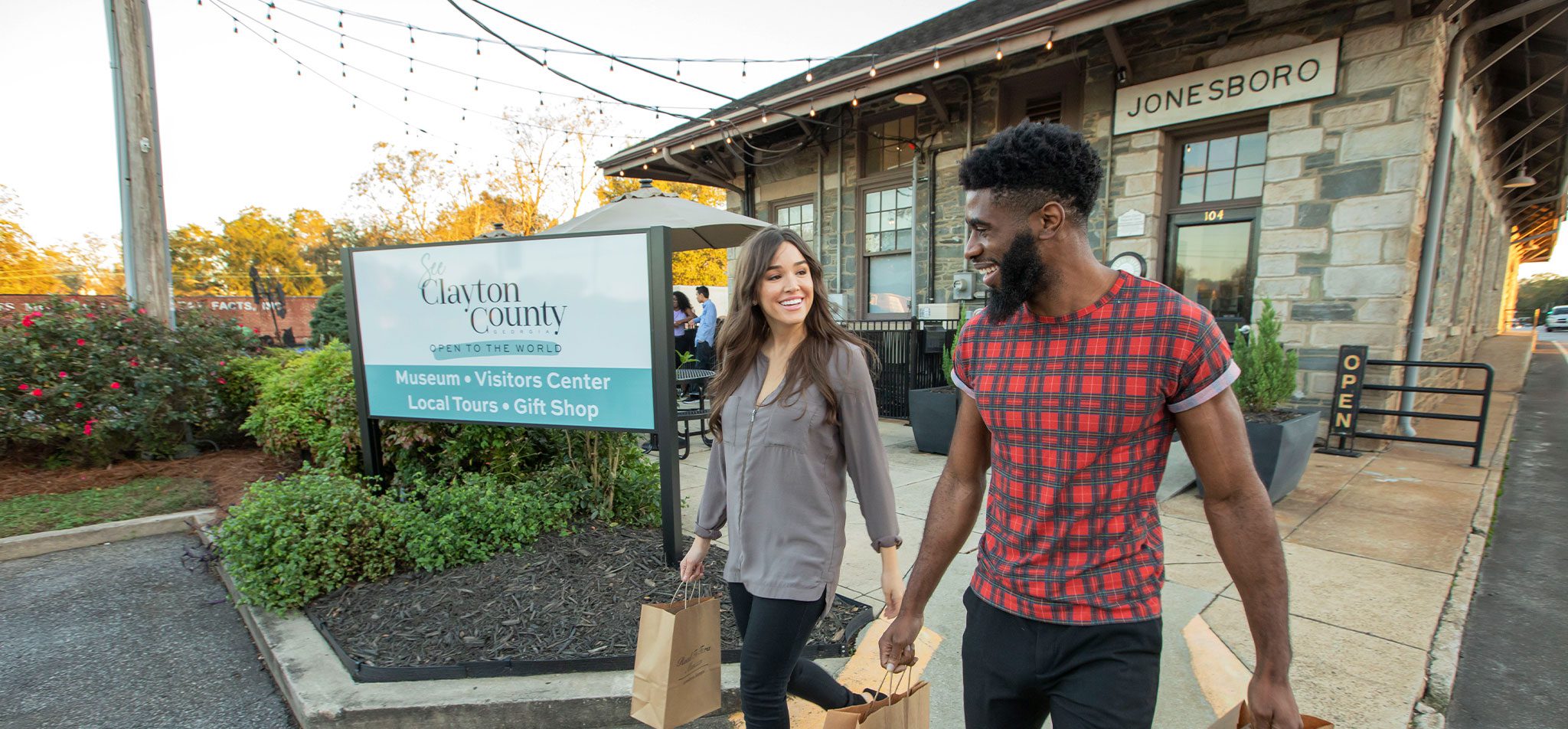 ClaytonCounty - people walking out of Visitors Center