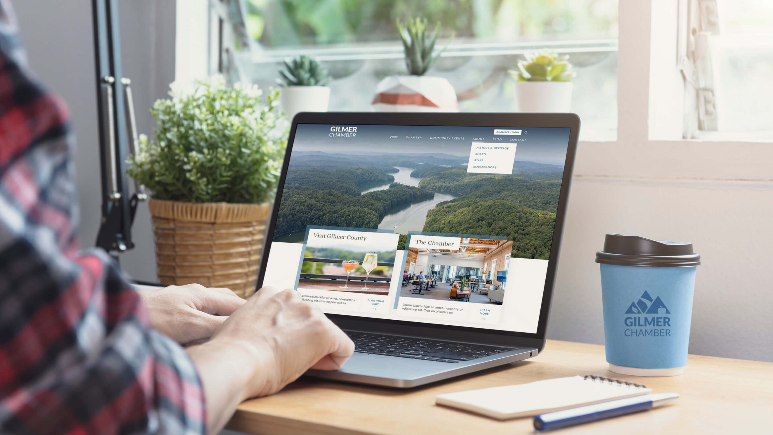 Man on laptop visiting the Gilmber Chamber website
