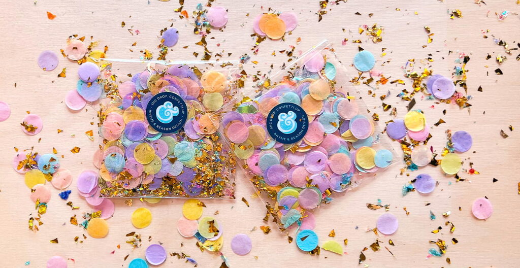 R&R Confetti Packets. Multi-color confetti and glitter exploding from two branded R&R packets.