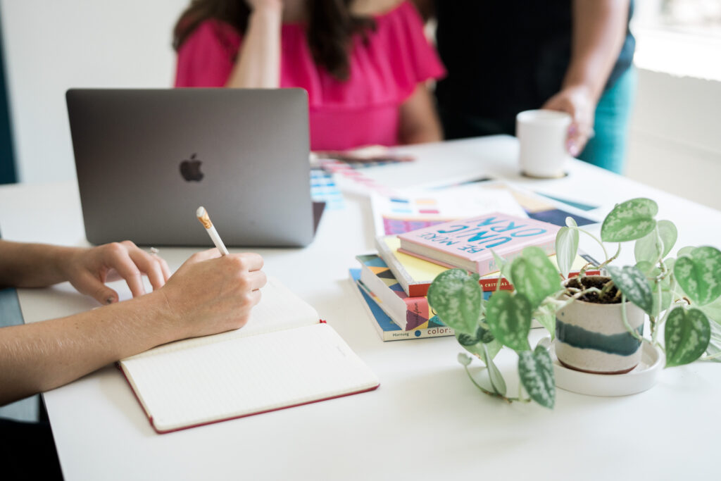 Photo of R&R team member writing in a notebook