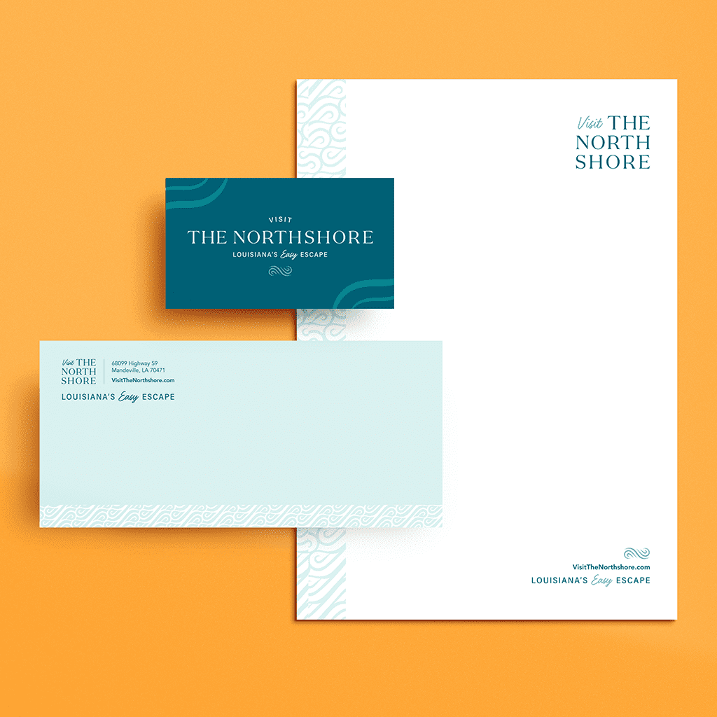 a visual mockup of custom designed Business card, envelope, and letterhead for Visit the Northshore