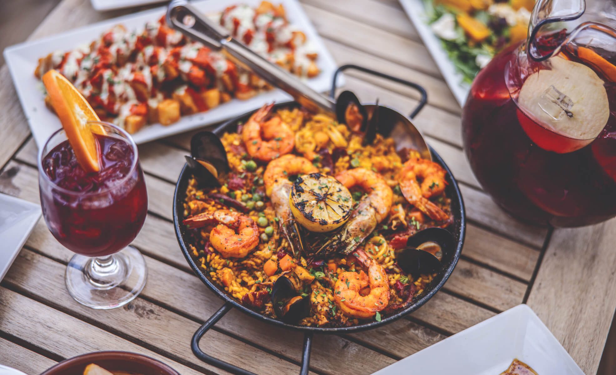 Paella and sangria on table