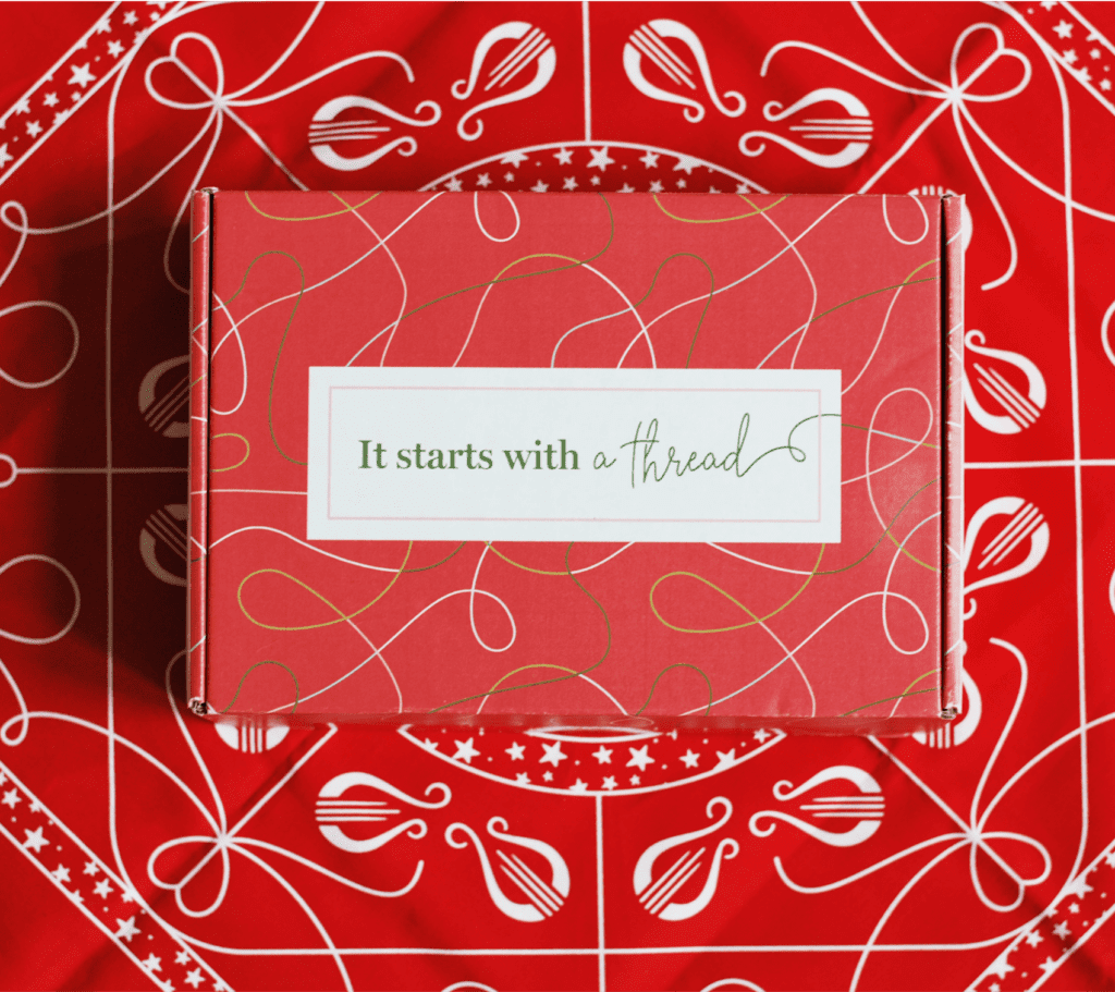 Alpha Chi Omega Uncommon Campaign influencer box atop bandana