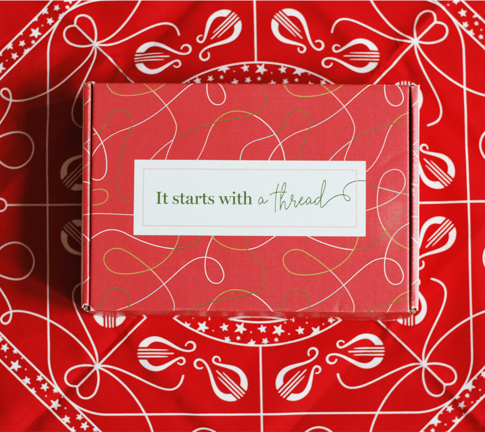 Alpha Chi Omega Uncommon Campaign influencer box atop bandana