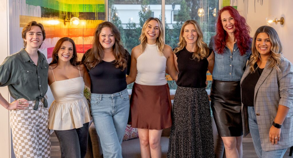 The seven team members of Rhyme & Reason standing together